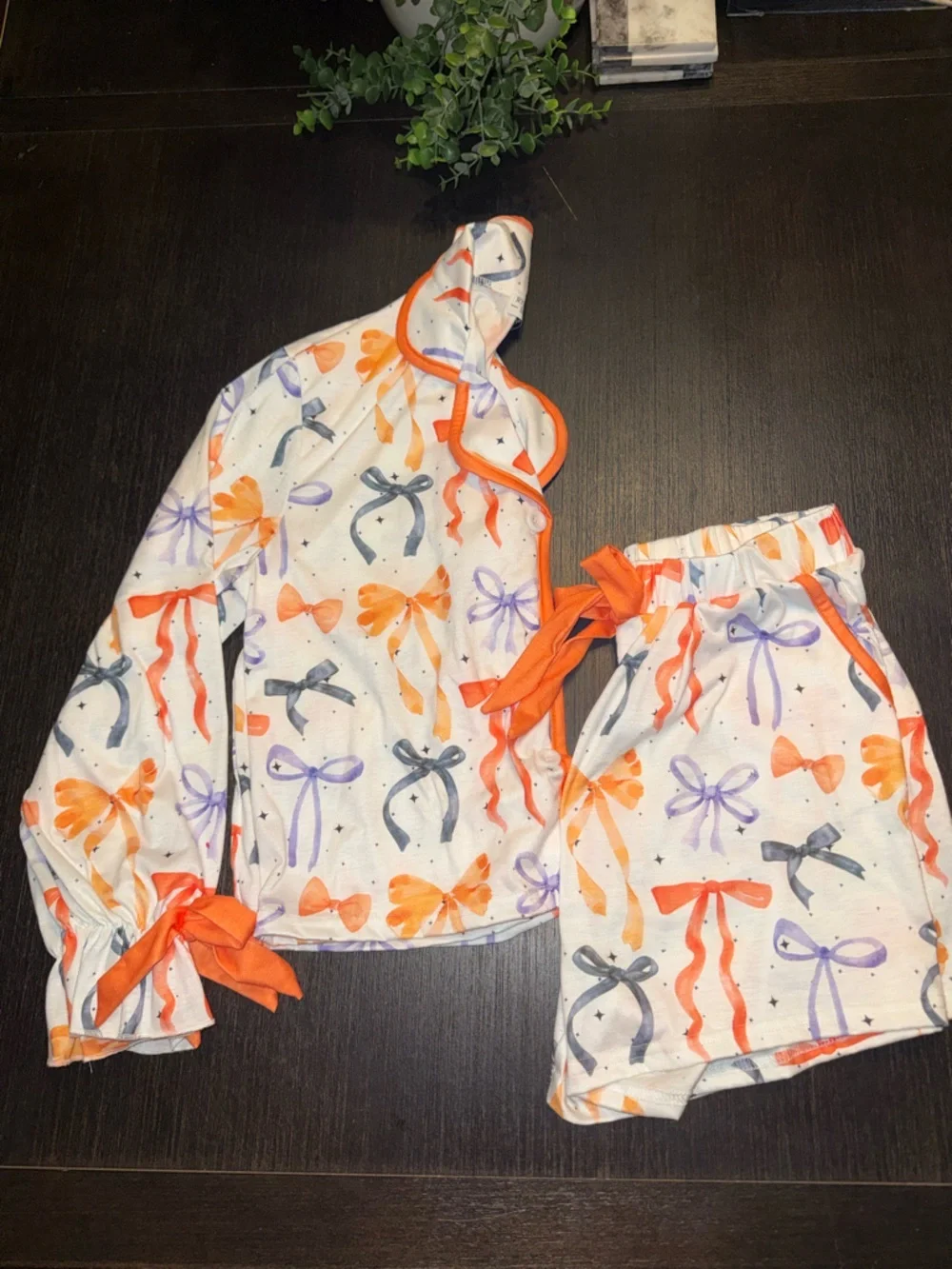 Primark White Elastic Waistband Shorts with Orange and Purple Star Print